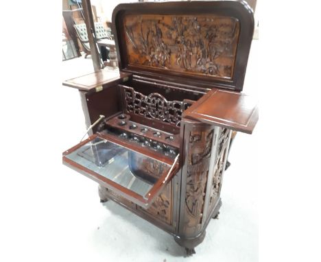  Sale Item:    MAHOGANY ORIENTAL CARVED COCKTAIL CABINET (AF)  Vat Status:   No Vat   Buyers Premium:  This lot is subject to