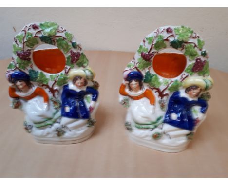  Sale Item:    PAIR STAFFORDSHIRE WATCH HOLDERS (AF)  Vat Status:   No Vat   Buyers Premium:  This lot is subject to a Buyers