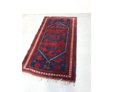  Sale Item:    RED & BLUE PATTERN RUG 6'5" X 3'10"  Vat Status:   No Vat   Buyers Premium:  This lot is subject to a Buyers P