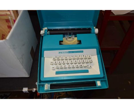 Petit Super International turquoise cased typewriter