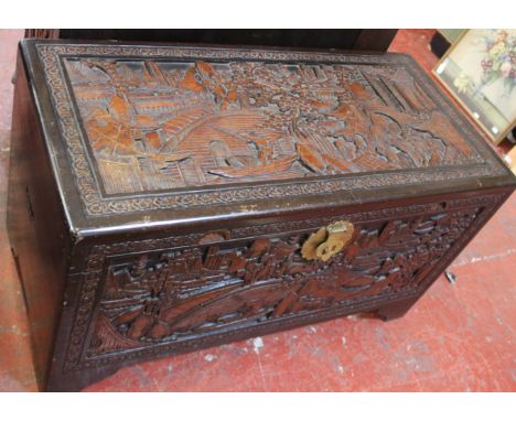 A heavily carved camphorwood Chinese design trunk 100cm wide 