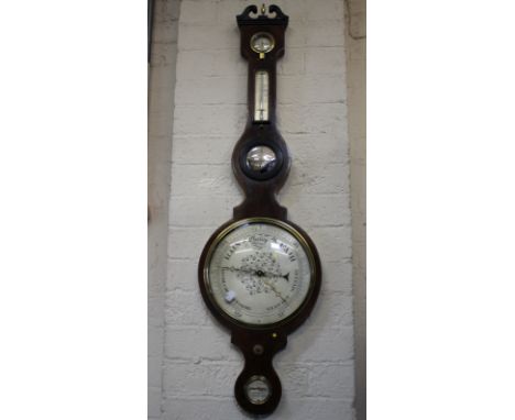 An Edwardian mahogany and boxwood strung barometer with swan neck pediment and silvered dials, J. Vassalli, Scarborough 108cm