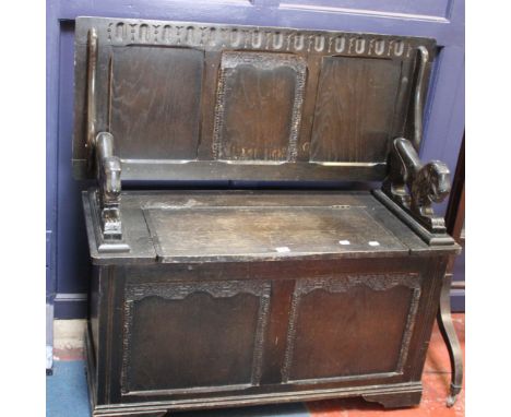 A Victorian style oak monks bench 