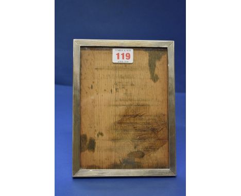 A silver engine turned photograph frame, by E Mander Ld, Birmingham 1938, 20 x 15cm.