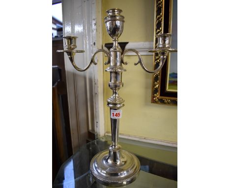 A pair of Old Sheffield plate twin branch candelabra.