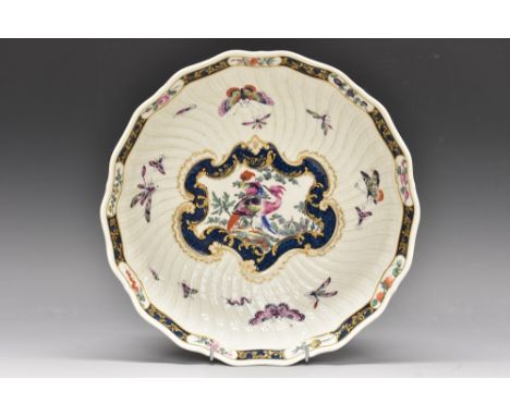 A large rare Worcester junket dish, the centre with scroll-moulded panel picked out in gilt and painted with two `fancy birds