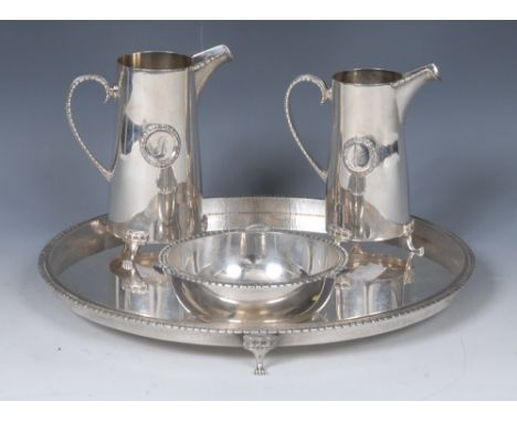 Christopher Nigel Lawrence (Bn.1936) - an Elizabeth II silver circular tray, textured border, paw feet with coronets to knees
