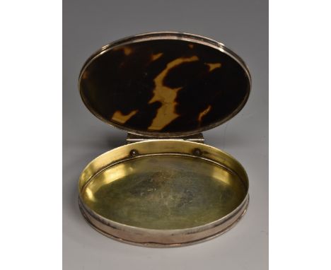 A George I silver and tortoiseshell oval snuff box, stand-away hinged cover, gilt interior, 8cm wide, apparently unmarked, c.