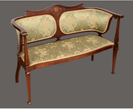 An Art Nouveau mahogany and marquetry sofa, serpentine cresting rail inlaid with stylised flowers on sinuous whiplash stems, 