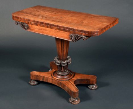 A William IV rosewood rounded rectangular card table, folding top enclosing a baize lined playing surface above a deep frieze