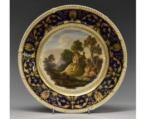 A Derby Named-View shaped circular plate, Near Wirksworth, Derbyshire, painted in the manner of Daniel Lucas, cobalt blue bor