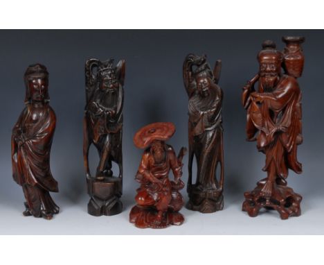 A pair of Chinese hardwood figures, each carved as an immortal, inlaid throughout with silver wire, 34cm high, 19th/early 20t