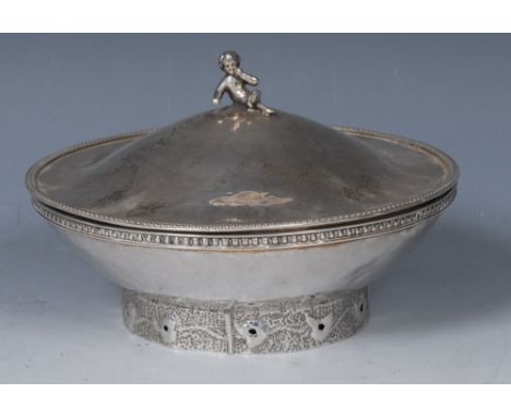 A silver Arts & Crafts style circular bowl and cover, the finial modelled as a putto, 8cm high, London 1950