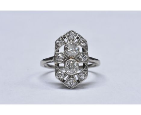 An Art Deco style shield ring, pierced crest inset with ten round cut diamonds, total estimated diamond weight approx 0.55ct,