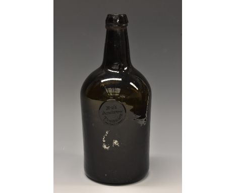An early 19th century sealed olive glass mallet wine bottle, the seal inscribed R. H. Andrew Tredinick, kick-up base 25.5cm h
