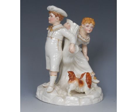 A Royal Worcester figure group, modelled by Kate Greenaway, of two children and King Charles Spaniel by a tree stump, in ivor