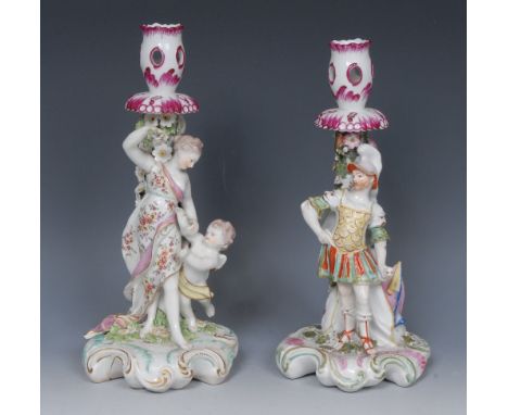 A pair of Derby Patch Mark candlestick,  Mars and Venus with Cupid,  Mars as a centurion, he stands wearing a feathered helme