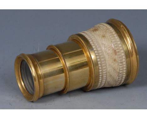 A 19th century French bone and lacquered brass three-drawer operatic monocular, the bone grip carved with wrythern flutes and