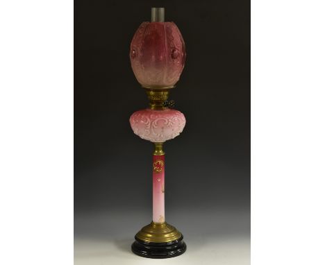 A Victorian pink vaseline glass table oil lamp, etched and moulded shade, Duplex burner, cylindrical pillar decorated in rais