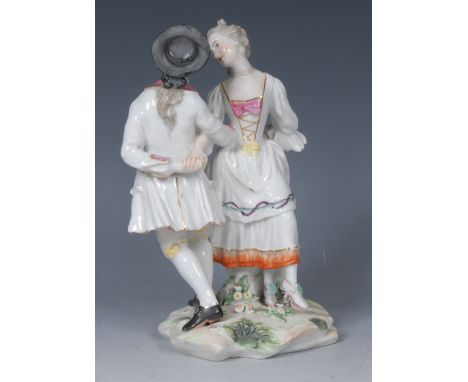 A Derby Patch Mark figure group, of a dancing couple, the young woman in a white dress with pink bow, e wearing a black ha, h