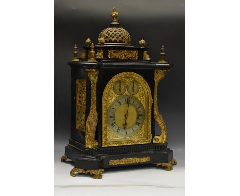 A Victorian ebonised bracket clock, the arched dial with silver chapter ring, Roman numerals and three winding holes, the arc