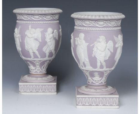 A pair of Wedgwood Lilac Jasperware cassolettes, overlaid in white with cherubs playing musical instruments, below anthemion 