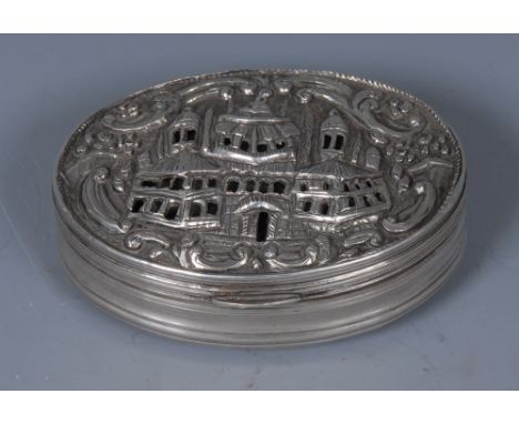 An 18th century Turkish silver oval snuff box, stand-away hinged cagework cover pierced and chased with a palace within a ban