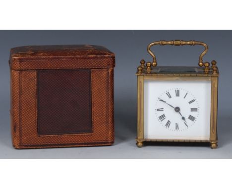 An early 20th century lacquered brass low carriage timepiece, 6.5cm rectangular enamel dial, with with Roman numerals,  swing