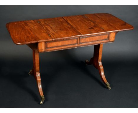 A 19th century yew 'sofa table', rounded rectangular top with a pair of hinged covers enclosing compartments, blind drawers t