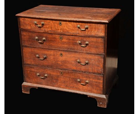 A George III oak chest, of small proportions, moulded oversailing top above four long graduated doors, brass swan neck handle