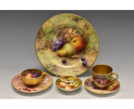 A Royal Worcester cabinet cup and saucer, painted with ripe peaches, blueberries, raspberries and apples on a mossy ground, t