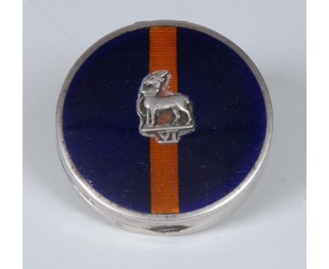 A George V silver and enamel 'sweetheart' rouge box, hinged cover applied with the insignia of the Royal Warwickshire Regimen