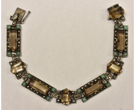 An Art Deco smoky quartz, turquoise and marcasite bracelet, composed of four large and four interspersed rectangular links, s