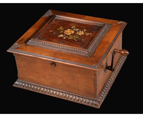 A 19th century walnut polyphon, The Symphonion, playing 34cm discs, rectangular hinged top transfer printed with a spray of f