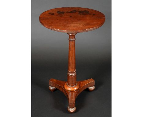 A George IV mahogany tripod occasional table, circular top, turned pillar, incurved canted triform base, bun feet, 73cm high,