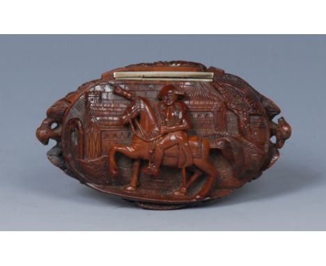 An early 19th century French coquilla snuff box, the hinged cover boldly carved in high relief with Napoleon Bonaparte progre
