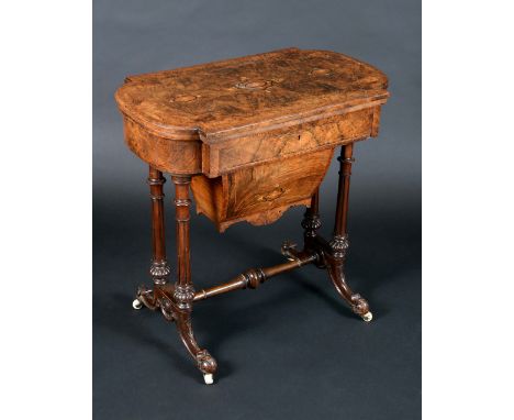 A Victorian burr walnut and marquetry shaped rectangular combination games and work table, folding top enclosing a plateau in