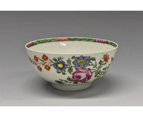 A Worcester bowl, decorated in the famille verte palette with floral spray, the interior with banded diaper border, 12cm diam