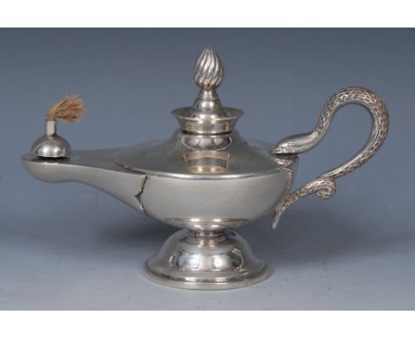An Anglo-Indian silver table cigar lighter, as a Roman lamp, spiral finial, serpent handle, domed circular foot, 15cm long, H