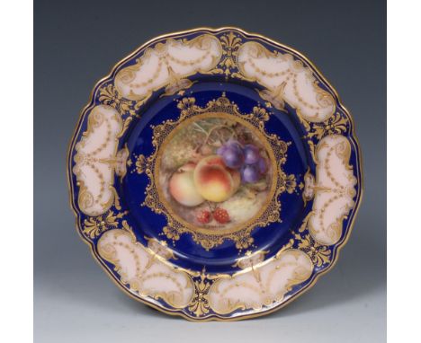A Royal Worcester shaped circular plate, painted by Richard Seabright, signed, with ripe peaches, raspberries and blue berrie
