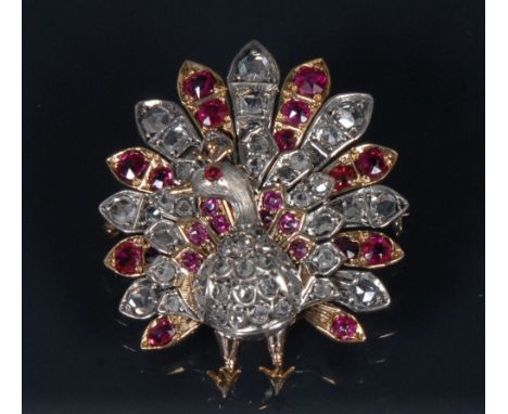 A 19th century diamond, ruby, spinel encrusted peacock brooch, modelled fan tail erect, pave encrusted with forty seven rose 