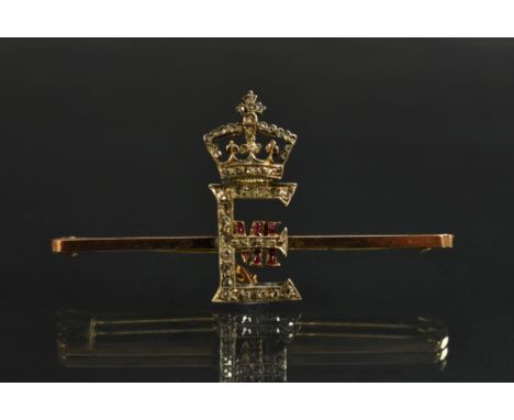 Royal Interest - an Edwardian 9ct gold, diamond and ruby presentation bar brooch, centred by the crowned royal cypher of Edwa