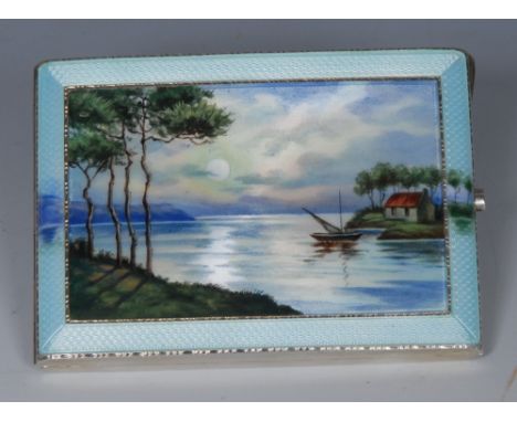 An early 20th century silver and enamel rectangular cigarette case, decorated in polychrome with a quiet lake, engine turned 
