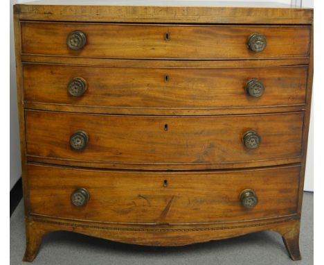 A George III mahogany bow fronted chest,  of four graduating cock beaded drawers satinwood and ebony inlay to frieze, bracket