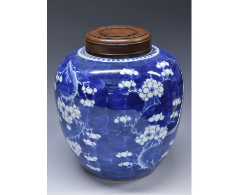 A large Chinese ovoid ginger jar, painted in tones of underglaze blue with blossoming prunus on a ground of cracked ice, hard