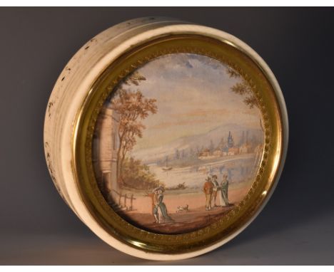 A Louis XVI Revival ivory circular snuff box, the push cover inset with a watercolour of figures in a Picturesque landscape, 