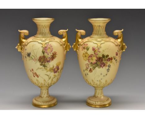 A pair of Royal Worcester two-handled pedestal ovoid vases, printed and painted with colourful summer flowers, on a blush ivo