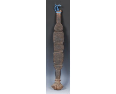 Tribal Art - a Tuareg tent peg, the broad central section shaped and carved in horizontal bands, domed pommel, 69cm high, Nor