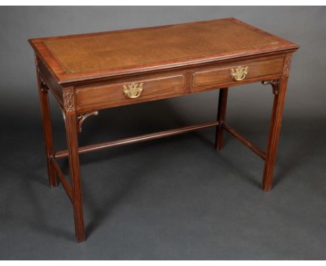 A Chippendale revival mahogany rectangular writing table, moulded top with inset tooled and gilt leather writing surface abov