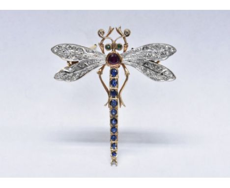 A diamond, emerald, sapphire and ruby dragonfly brooch, shaped arching sapphire tail, round cut ruby body, two emerald eyes, 